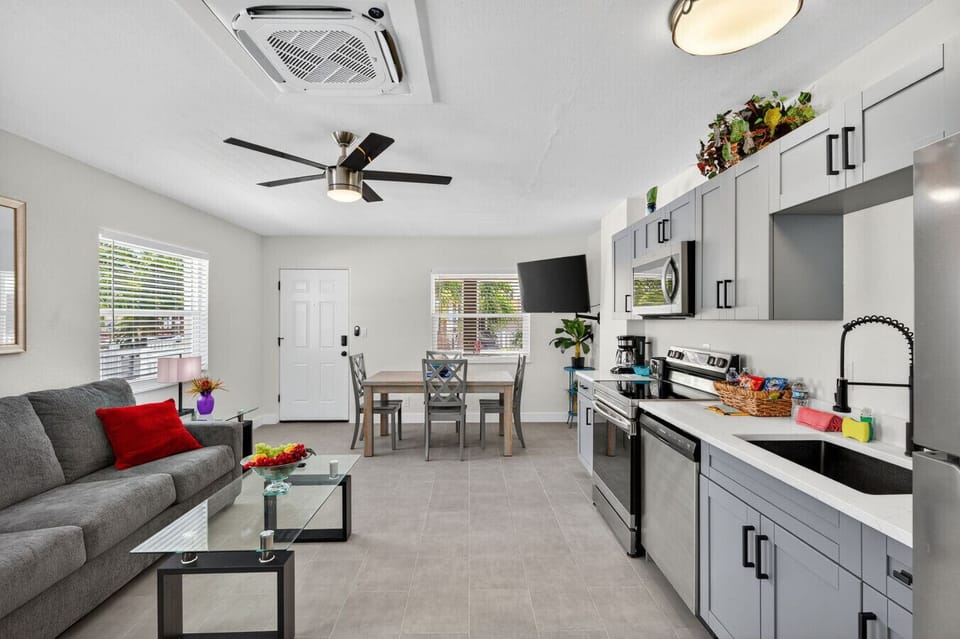Open-concept living & kitchen space w/ sleek finishes and room to relax together