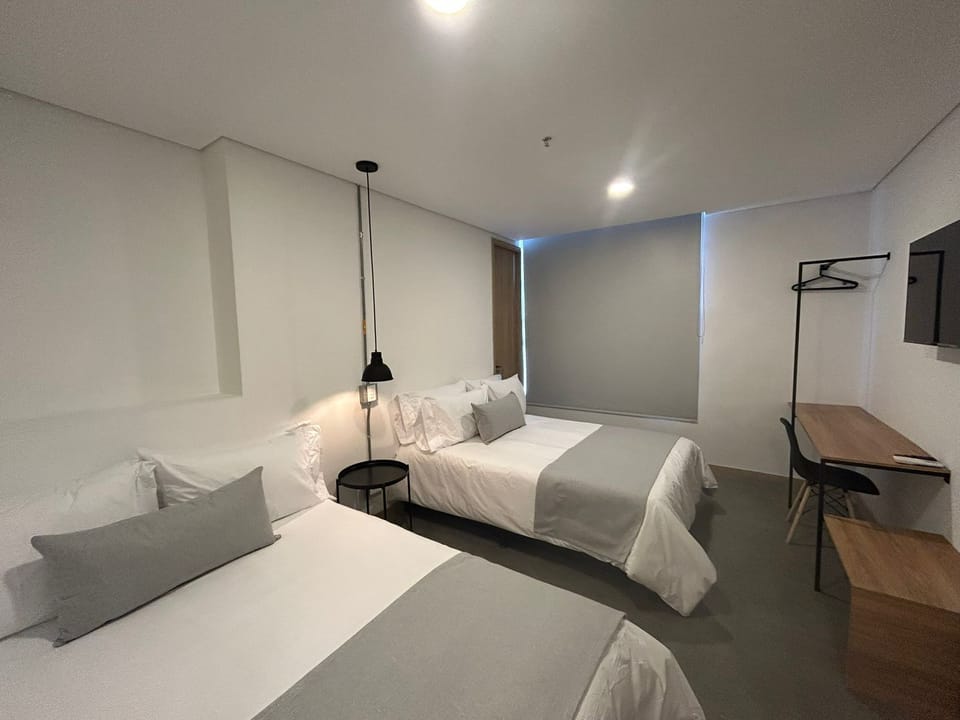 Deluxe Quadruple Room, City View | Desk, free WiFi