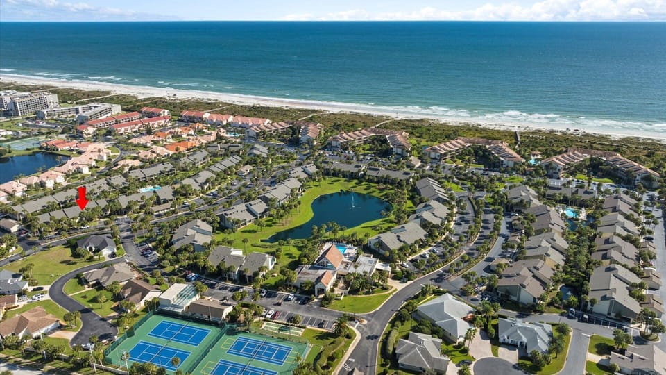 Prime location! Just a 5-minute walk to the beach via private community paths — no parking required. Stay steps from the shoreline with resort amenities at your fingertips.”