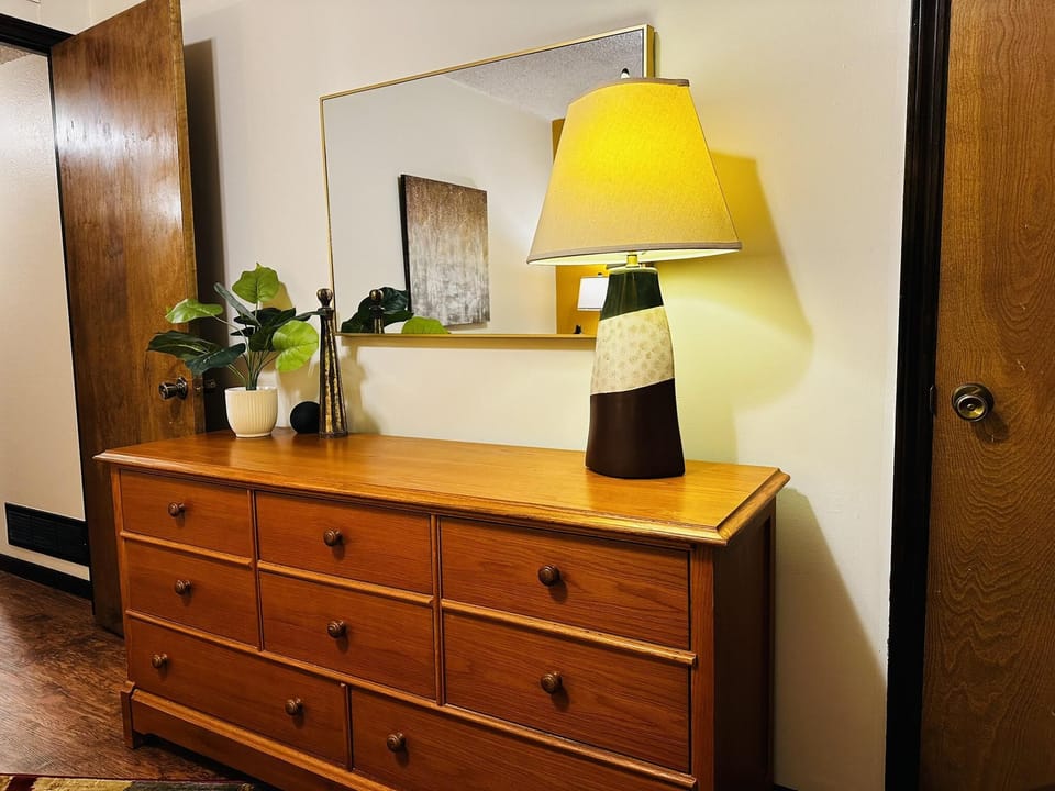 Cozy bedroom dresser area with warm ambient lighting