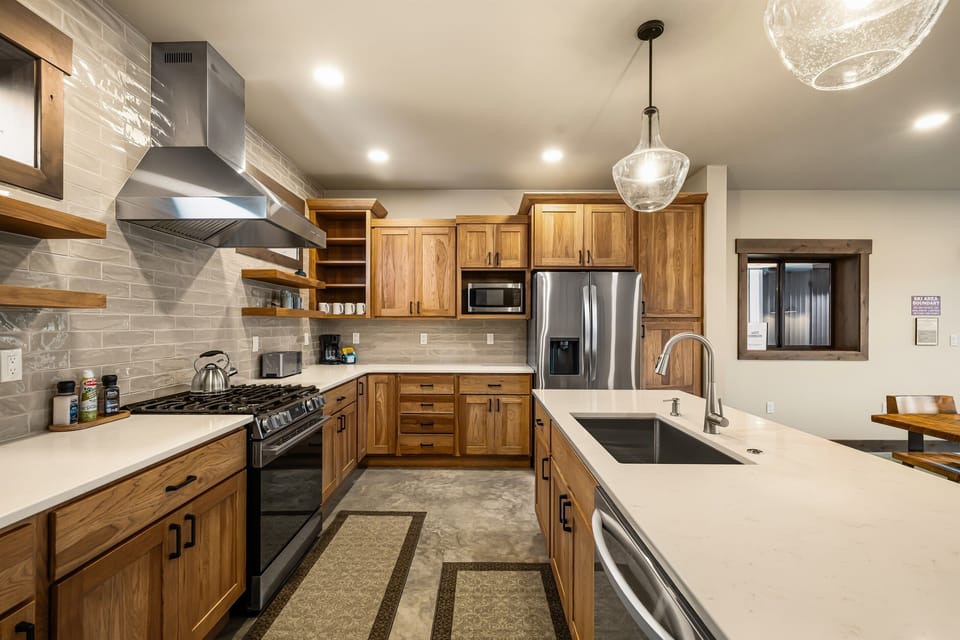 5 Burner Gas stove, Oven, Microwave, French door refrigerator, Freezer, Dishwasher, Hood fan, Stainless steel pots & pans