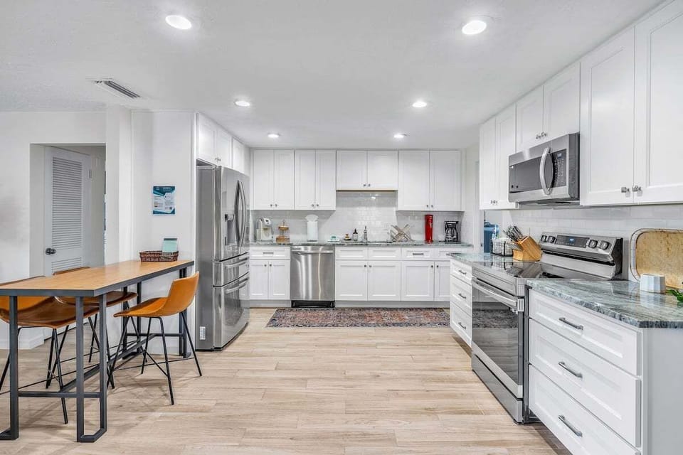 We love the full size kitchen with major appliances like a fridge, electric stove, dishwasher, and microwave! The table has 3 bar stools.