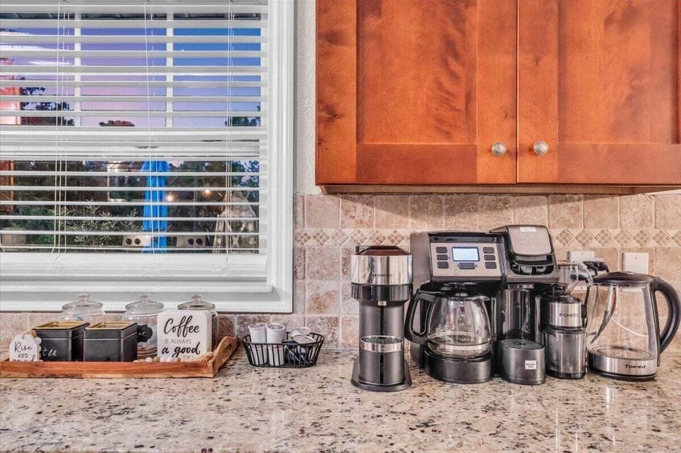 Check out this coffee set-up!  (Kitchen Cabinets are now painted white)