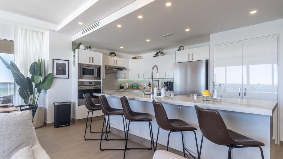 Raised seating at the kitchen counter.