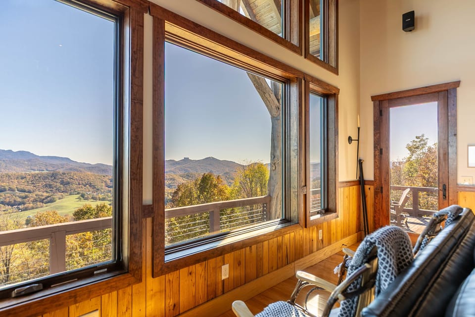 Settle into the living room and let the Blue Ridge Mountains fill every window. Fall color stretches for miles from this perch above Blowing Rock.