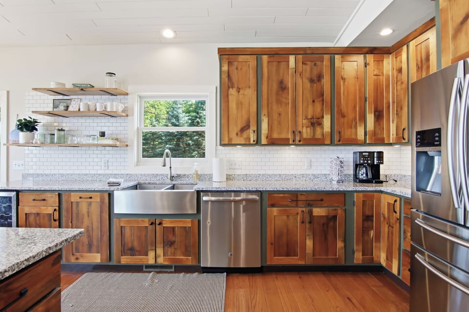 farmhouse kitchen sink and stainless steel dishwasher.  Kitchen comes fully stocked