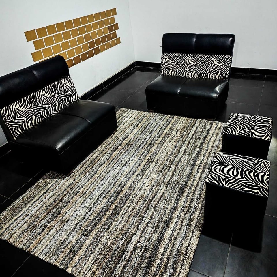Economy Quadruple Room | Living area