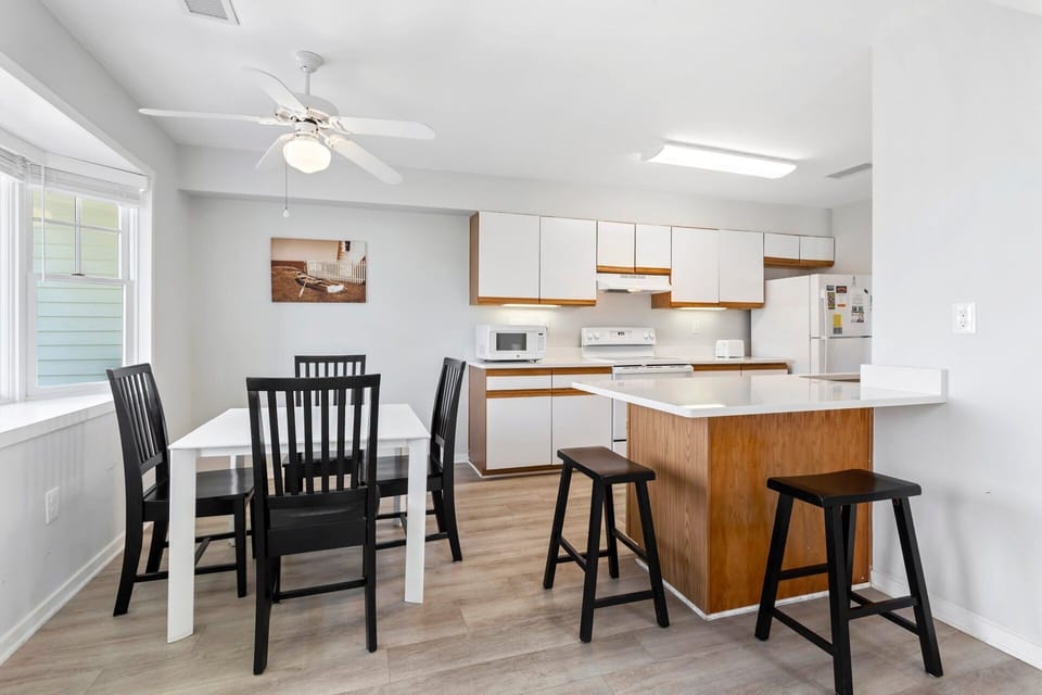 Dining & Game Table: Smaller dining-style table that doubles as a game and activity space—ideal for board games, puzzles, card games, or remote work.