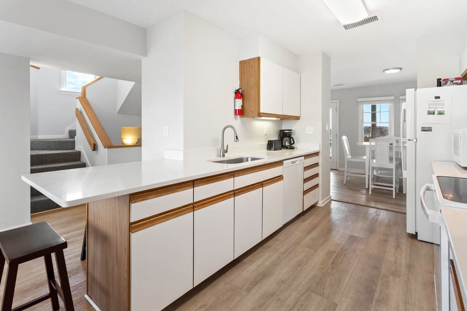 Prepare your favorite coastal dishes in the well-stocked kitchen featuring modern appliances and plenty of counter space.