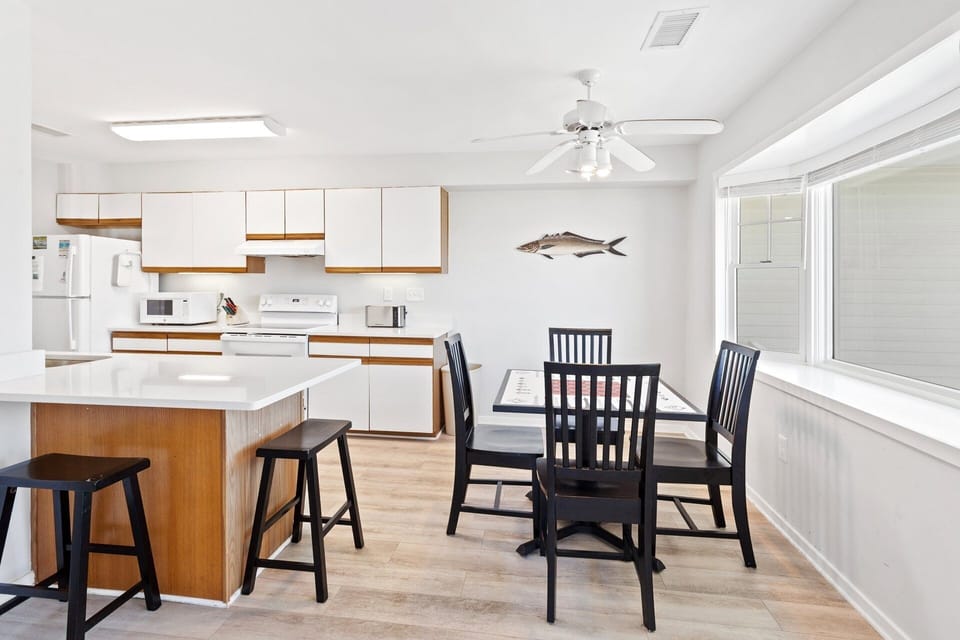 Dining & Game Table: Smaller dining-style table that doubles as a game and activity space—ideal for board games, puzzles, card games, or remote work.