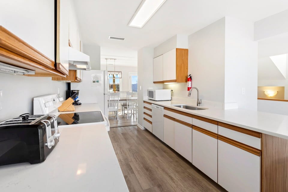 Prepare fresh meals or quick snacks in the well-stocked kitchen with modern appliances.