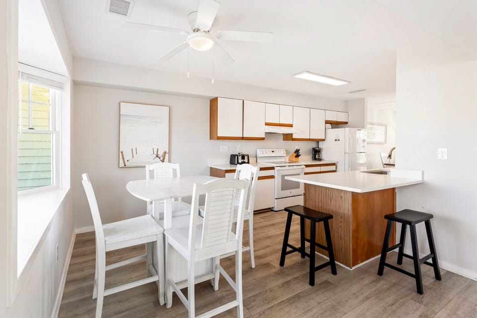 Gather for meals, games, or planning your next beach adventure in the open dining space.