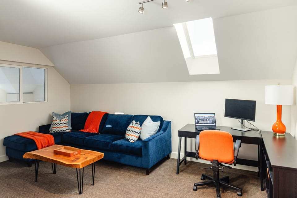 Second Living Room/Den - (upstairs) with a TV, sofa and dedicated work space