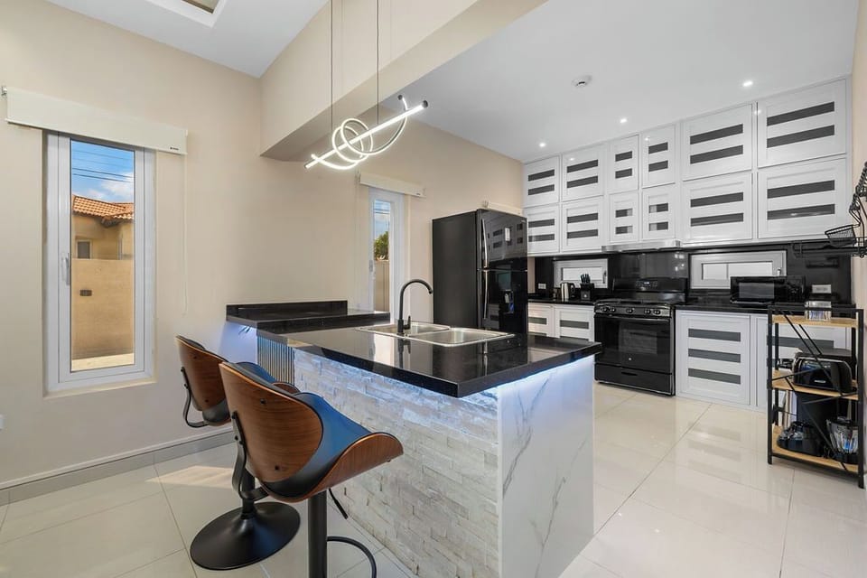 Cook with ease in the spacious kitchen, fully equipped with modern appliances, cookware, and all the essentials for preparing delicious meals during your stay.
