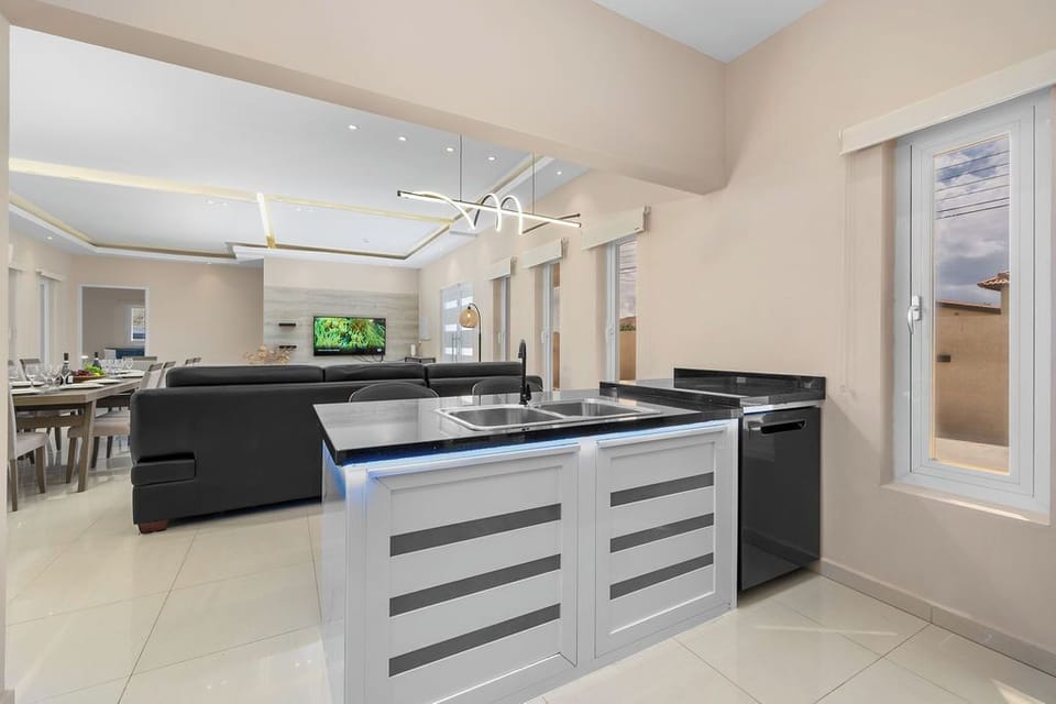 Cook with ease in the spacious kitchen, fully equipped with modern appliances, cookware, and all the essentials for preparing delicious meals during your stay.