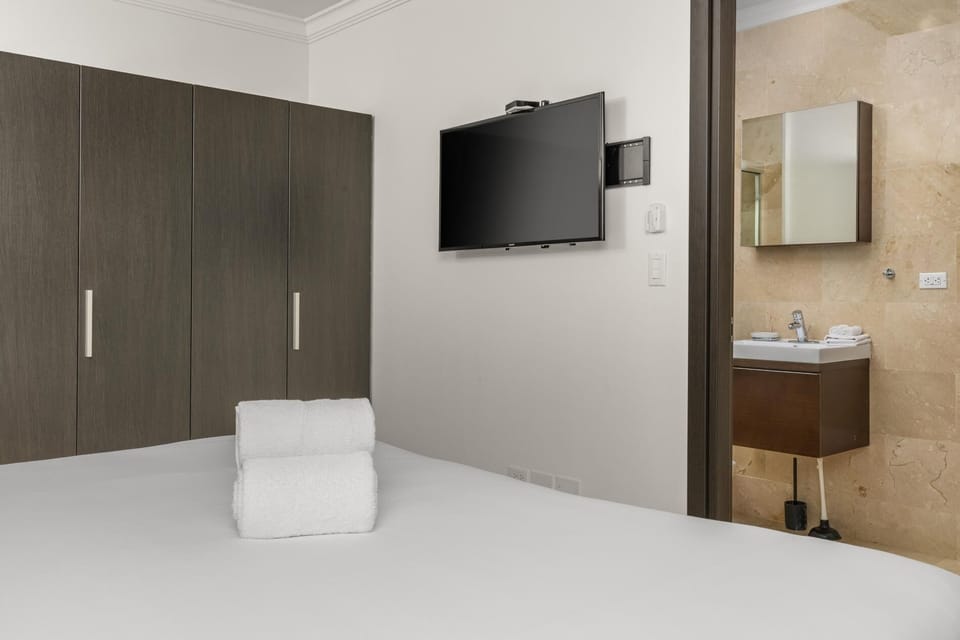Rest, relax, and repeat.  A beautifully appointed bedroom complete with an in-room TV and your own private ensuite bathroom.