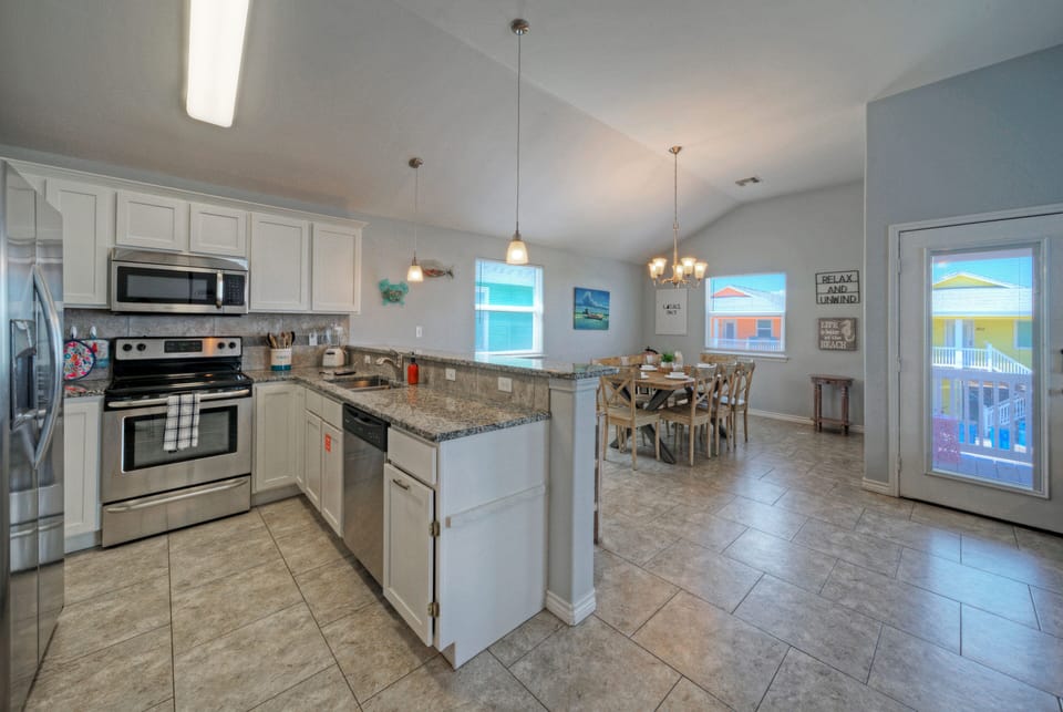 Fully stocked kitchen with ample counter space and reliable appliances.