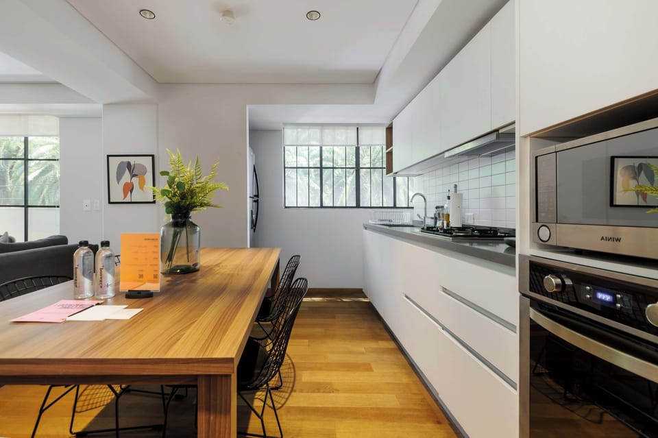 Bright kitchen with plenty of counter space and utensils.