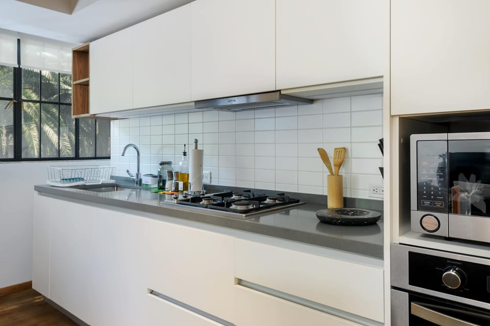 Fully equipped kitchen with modern appliances and essentials.