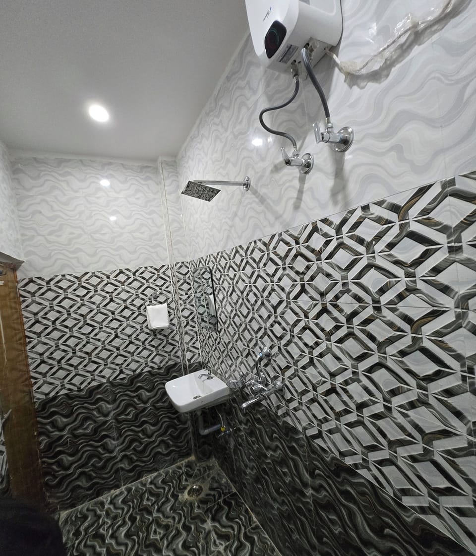 Shower, rainfall showerhead, bidet, towels