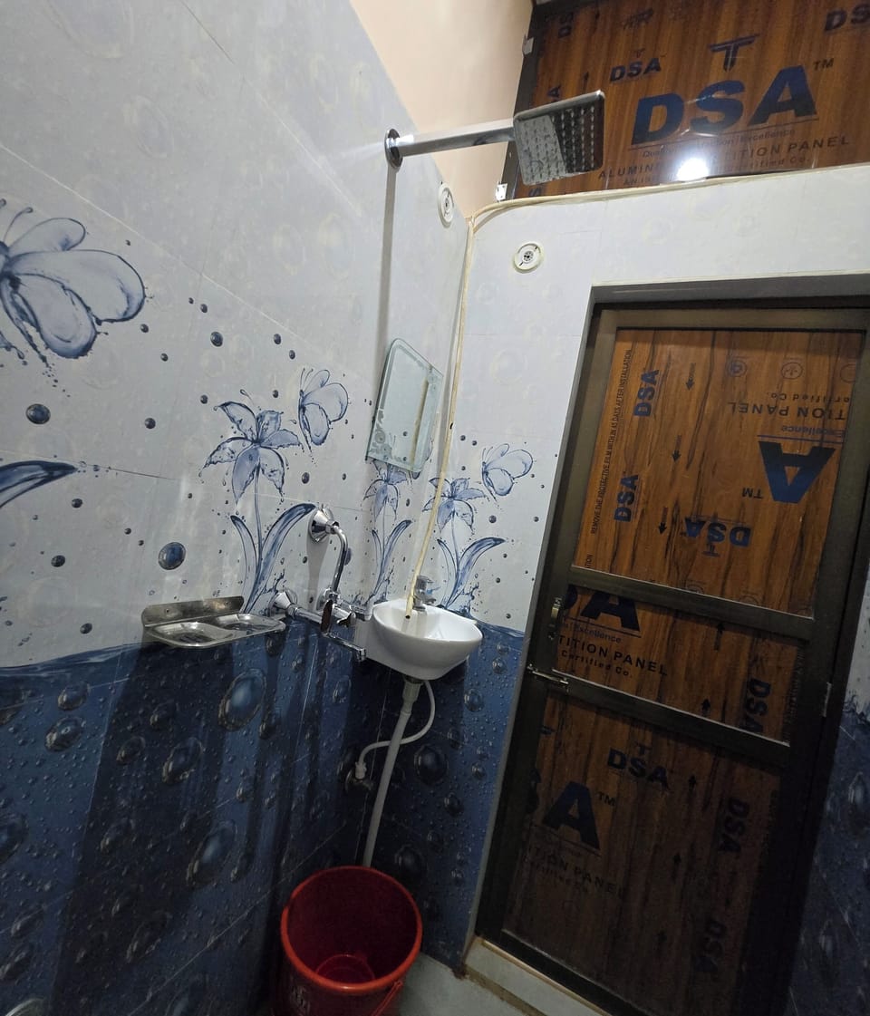 Shower, rainfall showerhead, bidet, towels