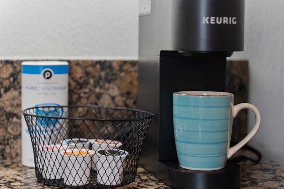 Start your morning right with a Keurig coffee maker and complimentary coffee essentials.