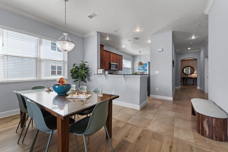 Charming dining area with seating for four and easy access to the kitchen.