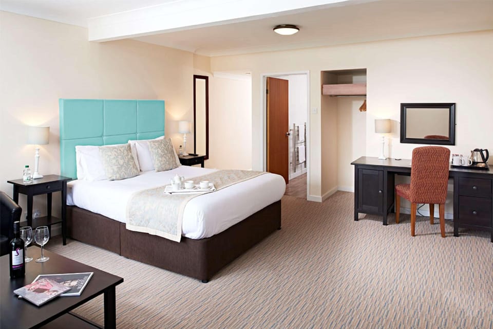 Premium bedding, desk, blackout drapes, iron/ironing board