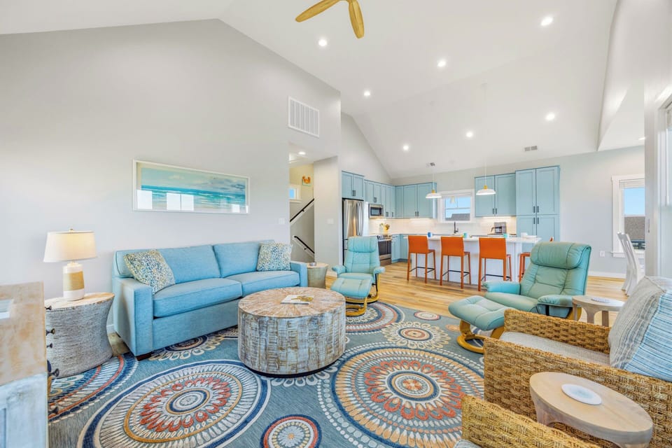 Relax into coastal comfort where soft blues and natural textures welcome you home. Gather around the kitchen island, sink into plush seating, and feel instantly at ease in this light-filled retreat.
