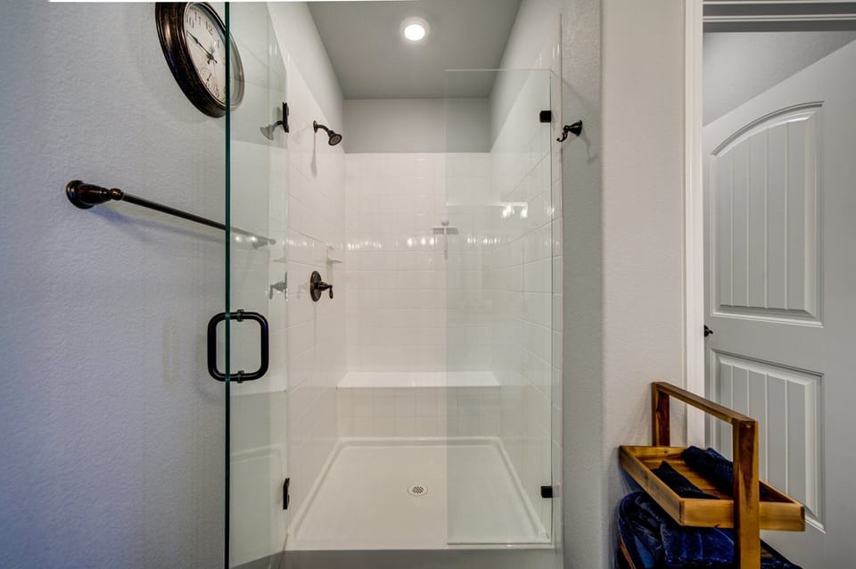 En-suite bathroom with dual vanity and walk-in shower
