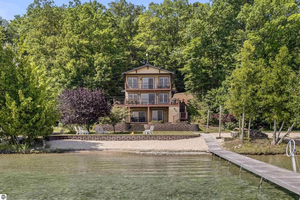 OVERVIEW:   The gorgeous home and its private beach, lakefront, and dock