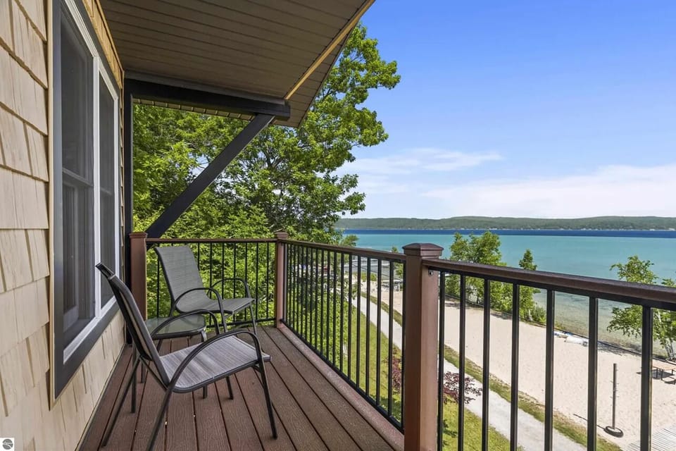 PRIMARY BEDROOM (UPPER LEVEL):  This is the private balcony for the primary bedroom, which features an incredible view of Crystal Lake from the balcony!
