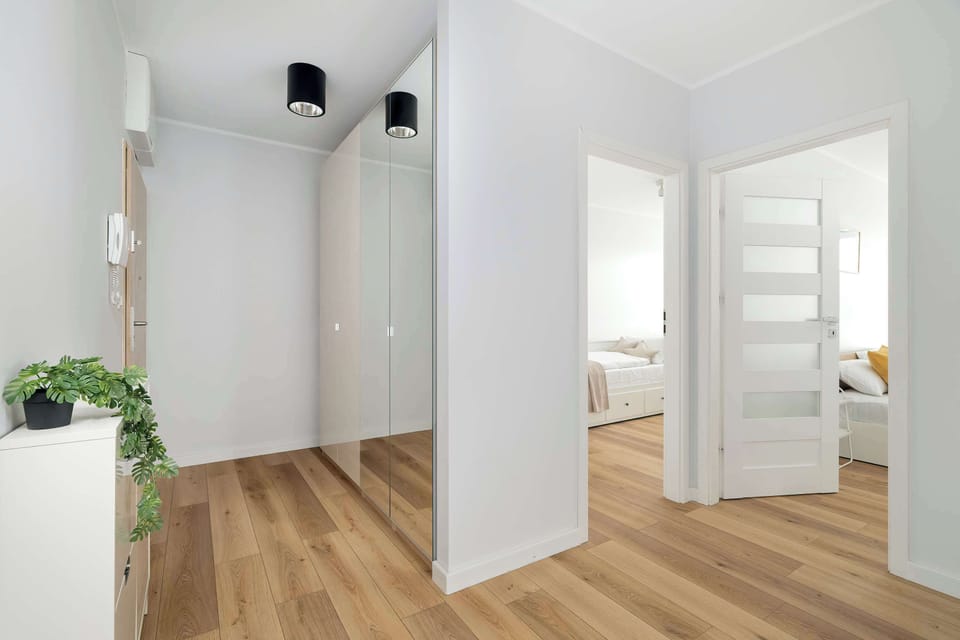 The living room's sleek design is both functional and aesthetically pleasing.