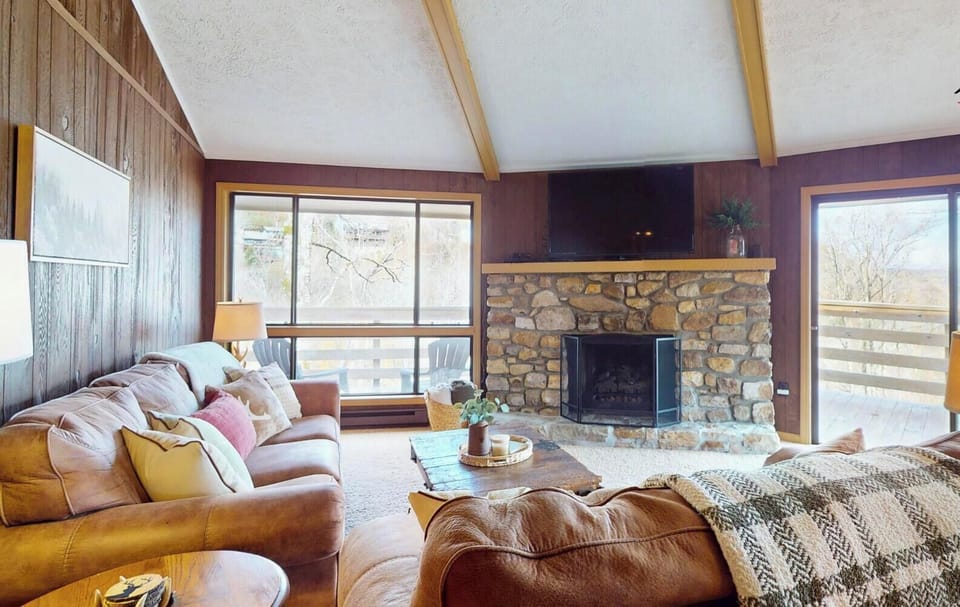 Cozy living room featuring a gas fireplace and comfortable seating, perfect for relaxing after a day on the mountain.