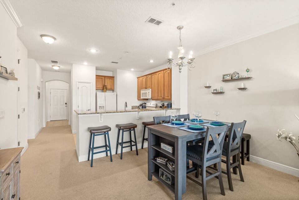 Open-concept layout connecting the kitchen, dining, and living areas—perfect for gathering, entertaining, or relaxing after a day at the beach.