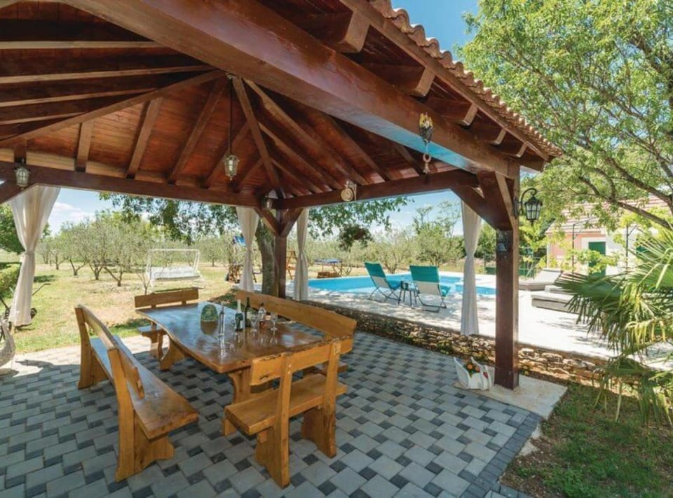 House (Holiday Home Marin AS with Pool) | Garden