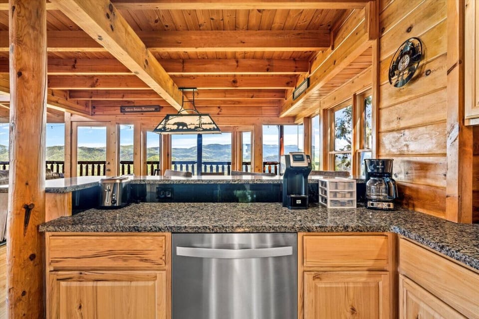 Start your morning right with a fresh brew and mountain scenery—this coffee bar setup sits perfectly beside panoramic views that’ll make every sip a moment to remember.