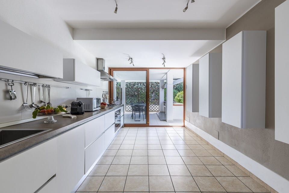 The kitchen accesses a shaded terrace.