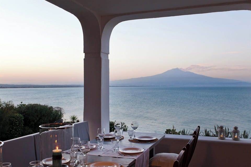 A magical spot for long al fresco dinners as the sun goes down behind Mount Etna.