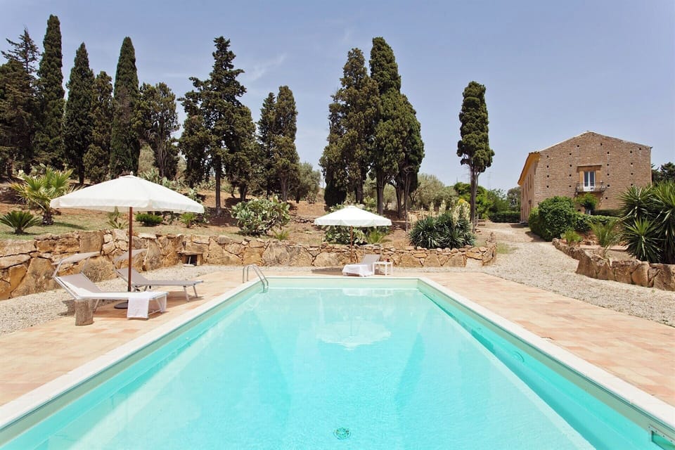 The pool and the side of the main house behind.