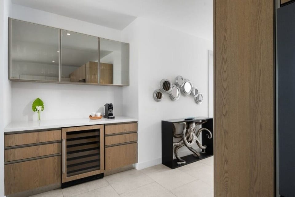 Sip morning espresso and chill wine at the built-in bar.