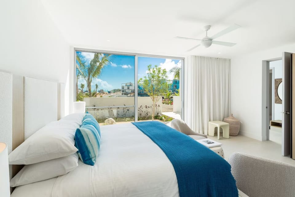 Drift off in crisp linens with sunlit garden views