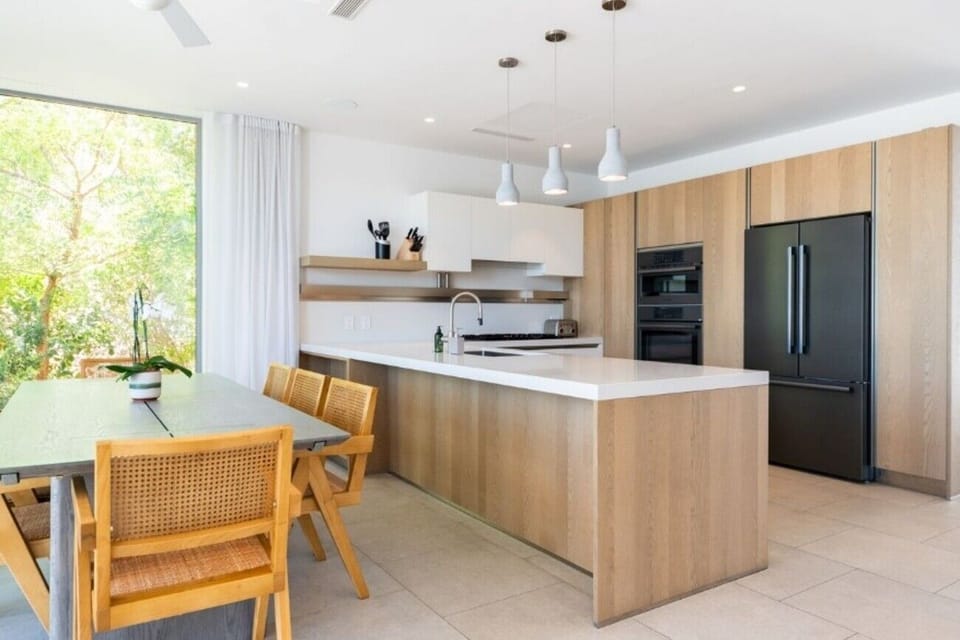 Cook together in the airy kitchen with generous island seating.