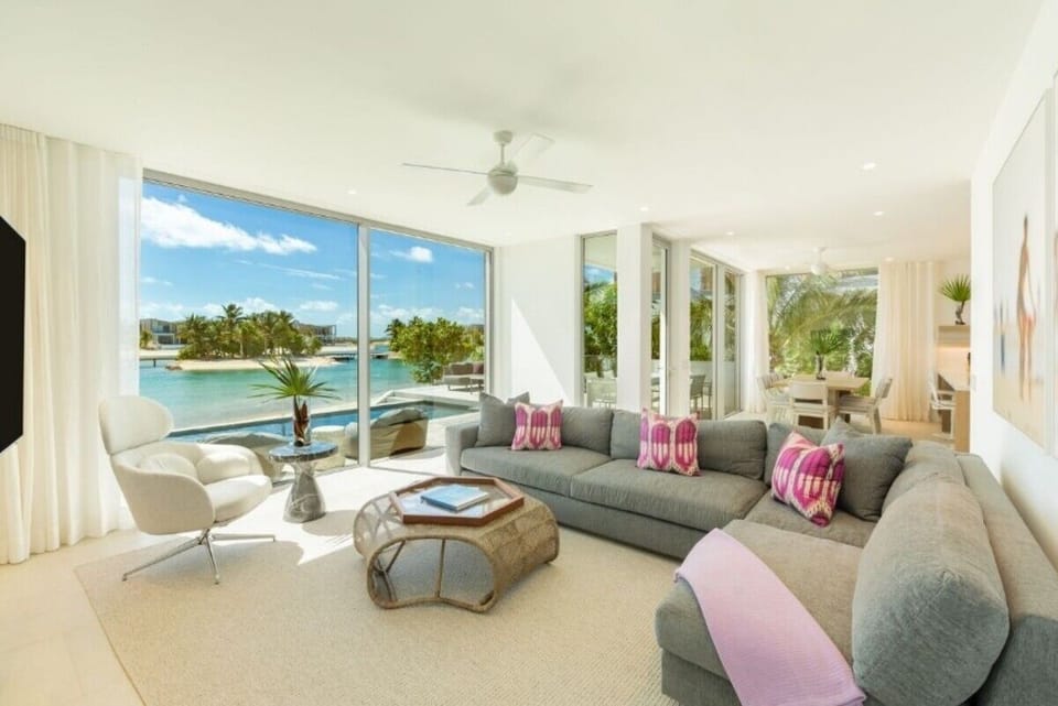 Unwind on the plush sectional with sunlit lagoon vistas.
