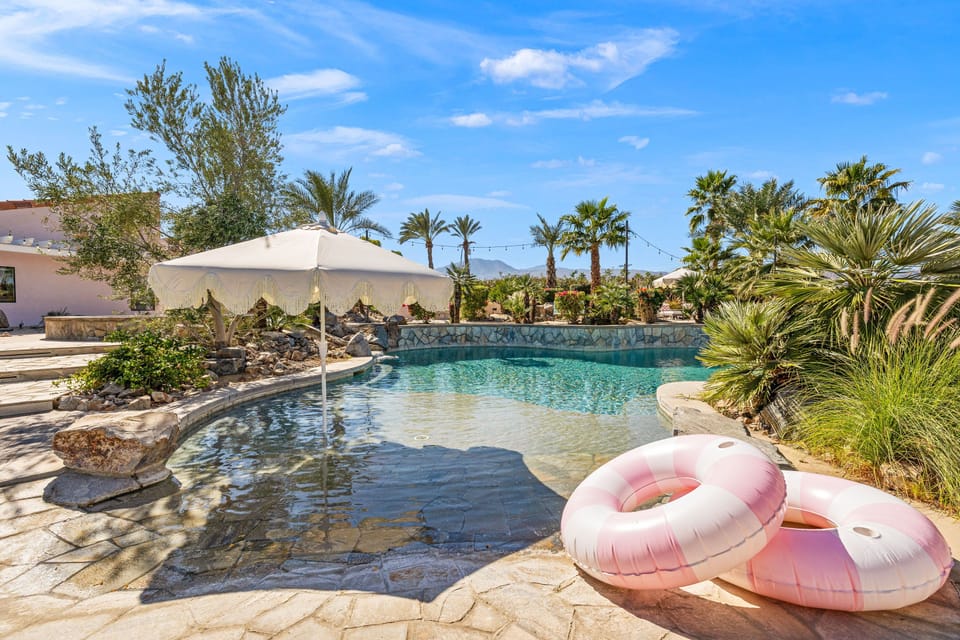 Beach entry pool bliss - catch shade while you float under the fringed umbrellas