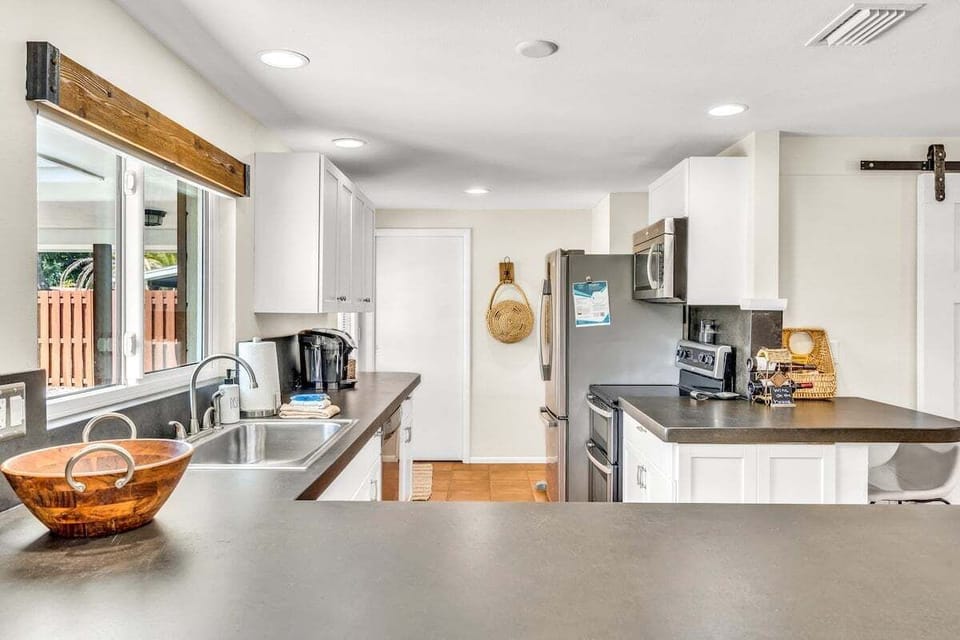 Beautiful, clean appliances and spacious countertops for cooking.