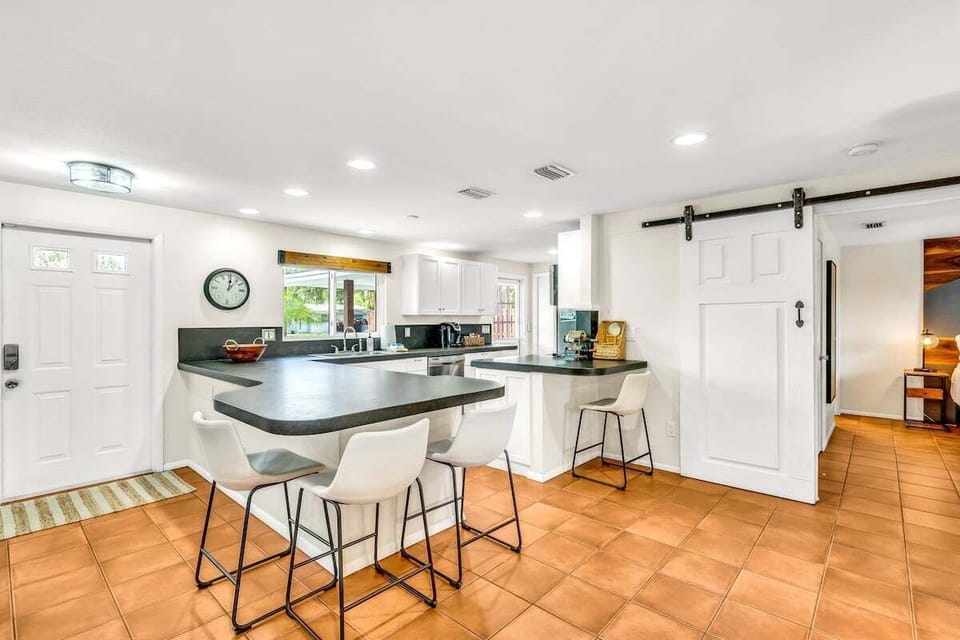 Enjoy cooking and conversations around the kitchen bar!