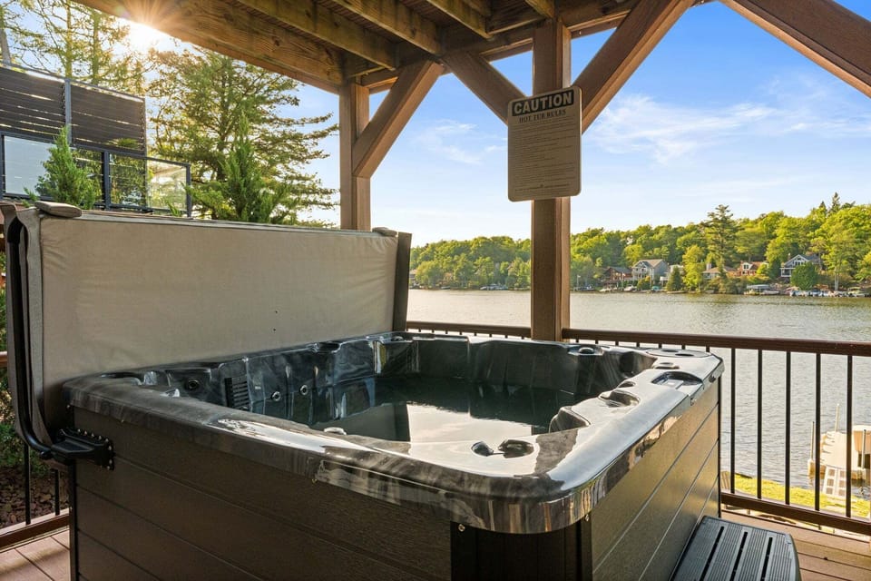 Relax in a the 6-8 person outdoor hot tub while taking in the view of Lake Harmony