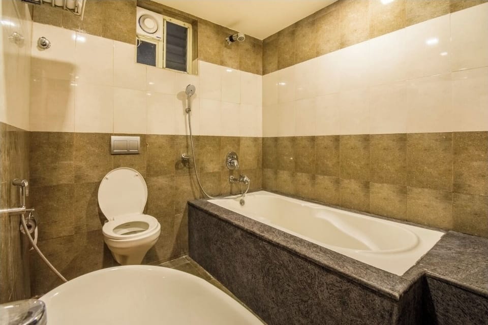 Junior Suite, Balcony, City View | Bathroom | Bathtub, slippers, towels, soap