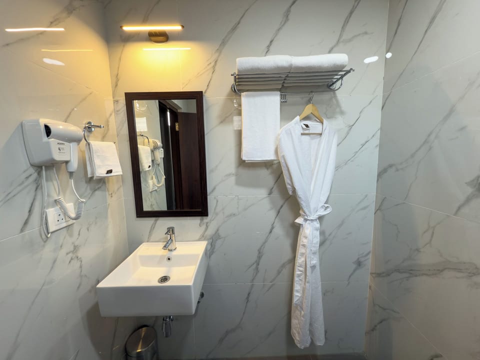 Shower, free toiletries, hair dryer, slippers